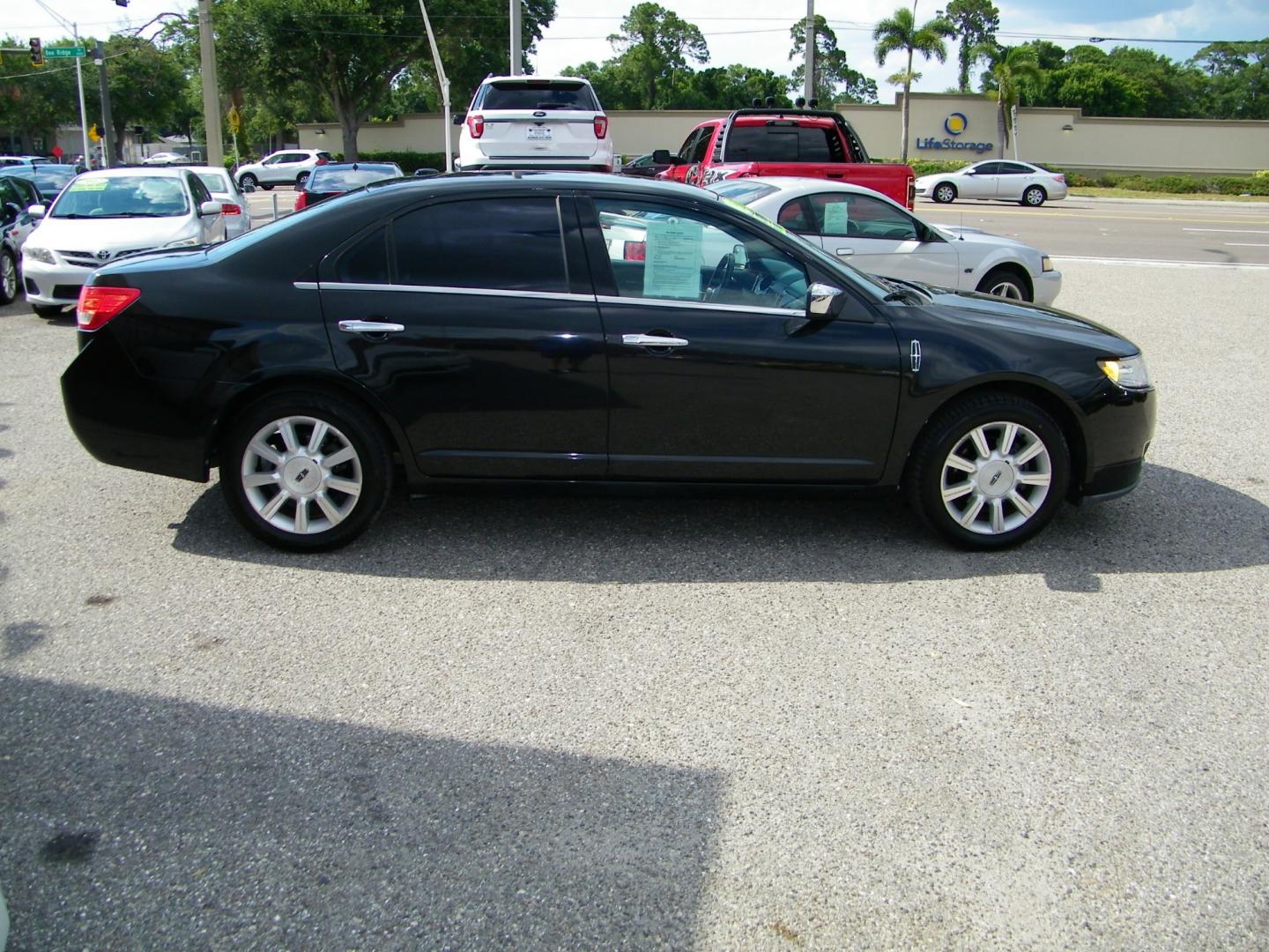 2011 Black /Black Lincoln MKZ FWD (3LNHL2GC0BR) with an 3.5L V6 DOHC 24V engine, 6-Speed Automatic transmission, located at 4000 Bee Ridge Road, Sarasota, FL, 34233, (941) 926-0300, 27.298664, -82.489151 - Photo#7